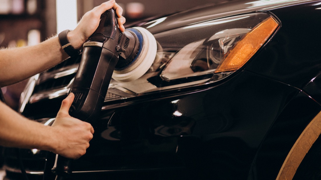 Polishing a black car's headlights